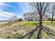 Expansive backyard features a well-maintained lawn, mature trees, a large patio, and ample space for outdoor activities at 29145 E 160Th Ct, Brighton, CO 80603
