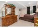 Comfortable bedroom with dresser, dark curtains, and recessed lighting at 29145 E 160Th Ct, Brighton, CO 80603