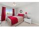 Cozy bedroom featuring a ceiling fan, bright window, and neutral carpeting at 29145 E 160Th Ct, Brighton, CO 80603