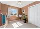 Bedroom featuring neutral walls and carpeting, with ample natural light from a window at 29145 E 160Th Ct, Brighton, CO 80603