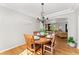Dining room featuring a round table with hardwood floors and open layout at 29145 E 160Th Ct, Brighton, CO 80603