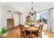 Bright dining room with wooden table, chairs, hardwood floors, and natural light at 29145 E 160Th Ct, Brighton, CO 80603
