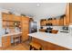 Spacious kitchen featuring a large island, stainless steel appliances, and a charming built-in desk area for added convenience at 29145 E 160Th Ct, Brighton, CO 80603