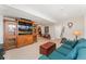Spacious living area with an entertainment center, comfortable sofa, and open layout perfect for gatherings at 29145 E 160Th Ct, Brighton, CO 80603