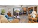 Cozy living room with a stone fireplace, comfortable seating, and natural light at 29145 E 160Th Ct, Brighton, CO 80603