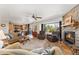 Inviting living room with a cozy fireplace, hardwood floors, and an open layout at 29145 E 160Th Ct, Brighton, CO 80603
