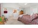 Vaulted ceiling main bedroom showcasing a neutral palette, natural light, and adjacent bathroom at 29145 E 160Th Ct, Brighton, CO 80603