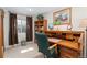Charming office featuring classic wooden desk and ample natural light at 29145 E 160Th Ct, Brighton, CO 80603