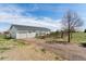 Outbuilding with garage, sliding door, and fenced in area at 29145 E 160Th Ct, Brighton, CO 80603
