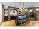 Beautiful bar with stone and brick accents, perfect for entertaining guests at 7208 Raphael Ln, Littleton, CO 80125