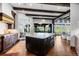 Spacious kitchen with dark wood cabinetry, a central island, and an adjoining dining area with scenic views at 7208 Raphael Ln, Littleton, CO 80125