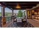 Relaxing outdoor patio with stone flooring, a dining table, and scenic views of the mountains at 7208 Raphael Ln, Littleton, CO 80125