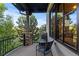 Enjoy a scenic view from this private patio with wrought iron railings and stone pillars at 7208 Raphael Ln, Littleton, CO 80125