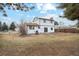 View of the backyard and house at 9777 W 75Th Way, Arvada, CO 80005