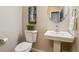 Cozy half bathroom featuring a modern sink and neutral décor at 9777 W 75Th Way, Arvada, CO 80005