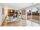 Inviting living room with fireplace, leads to a slider and view of the backyard, and comfortable seating near the window at 9777 W 75Th Way, Arvada, CO 80005