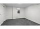 Finished basement space with neutral paint, window, carpet, and a closet perfect for storage at 451 S Franklin St, Denver, CO 80209