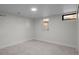 Basement bedroom with natural light, carpet flooring, and white walls creating a cozy space at 451 S Franklin St, Denver, CO 80209