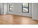 Bright, spacious bedroom with hardwood floors, white walls, and windows, creating a serene and airy atmosphere at 451 S Franklin St, Denver, CO 80209