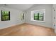 Bright, airy bedroom with hardwood floors, two windows and window seats, creating a relaxing retreat at 451 S Franklin St, Denver, CO 80209
