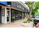 Charming exterior of Devil's Food restaurant with elegant signage, inviting entrance, and sidewalk planters at 451 S Franklin St, Denver, CO 80209