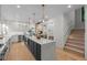 Bright, modern kitchen with a large island, stainless steel appliances, and elegant pendant lighting at 451 S Franklin St, Denver, CO 80209