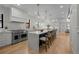 Bright, open kitchen with an island, modern appliances, and hardwood floors at 451 S Franklin St, Denver, CO 80209