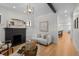 Comfortable living room features a fireplace, hardwood floors, and natural light at 451 S Franklin St, Denver, CO 80209