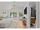 Bright main bedroom featuring an ensuite bathroom and ample natural light at 451 S Franklin St, Denver, CO 80209