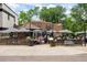 Outdoor seating at a restaurant with shaded tables, providing a relaxed dining experience in a vibrant setting at 451 S Franklin St, Denver, CO 80209