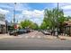 Charming street featuring parked cars, sidewalks, shops and trees, creating a pleasant and walkable neighborhood atmosphere at 451 S Franklin St, Denver, CO 80209