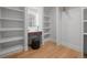 Walk-in closet offers ample shelving, dressing table with mirror, and wood floors for a functional space at 451 S Franklin St, Denver, CO 80209