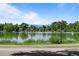 Scenic view of Washington Park's Smith Lake with calm waters, trees, and homes along the shore at 451 S Franklin St, Denver, CO 80209