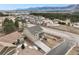 Expansive aerial view of a neighborhood showcasing the home's location and surrounding mountain views at 19703 Serenity Springs Pt, Monument, CO 80132