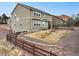 Large backyard features gravel and minimal grass landscaping at 19703 Serenity Springs Pt, Monument, CO 80132