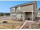 Backyard features gravel landscaping and built-in fire pit at 19703 Serenity Springs Pt, Monument, CO 80132