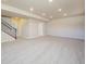 Large, open basement area with plush carpeting and ample space for storage or recreation at 19703 Serenity Springs Pt, Monument, CO 80132