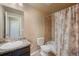 Neutral bathroom boasts shower and bathtub at 19703 Serenity Springs Pt, Monument, CO 80132
