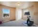 Spacious bedroom provides great natural light and features a stationary exercise bike at 19703 Serenity Springs Pt, Monument, CO 80132
