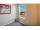 Bedroom corner boasts a bright window with mountain views and a decorative artwork at 19703 Serenity Springs Pt, Monument, CO 80132