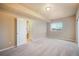 Bright bedroom features a large window and neutral carpet at 19703 Serenity Springs Pt, Monument, CO 80132