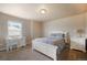 Comfortable bedroom featuring a bed, desk, and nightstand at 19703 Serenity Springs Pt, Monument, CO 80132