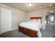 Comfortable bedroom featuring plush carpeting and a well-lit ceiling fixture at 19703 Serenity Springs Pt, Monument, CO 80132