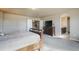 Spacious bedroom featuring a bed, TV, closet, and a view of the bathroom through an arched doorway at 19703 Serenity Springs Pt, Monument, CO 80132