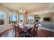 Dining room features hardwood floors, chandelier, and windows with scenic views and a 
