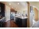 Spacious kitchen featuring stainless steel appliances, granite countertops, and a large island at 19703 Serenity Springs Pt, Monument, CO 80132