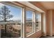 Bright windows offer panoramic views of the mountains in this spacious, light-filled room at 19703 Serenity Springs Pt, Monument, CO 80132