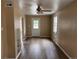 Inviting living room with hardwood floors, fresh paint, lots of natural light, and a modern ceiling fan at 4875 Lowell Blvd, Denver, CO 80221