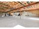 Large, unfinished basement with concrete flooring offers potential for customization at 5129 S Tom Bay Rd, Bennett, CO 80102