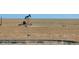 View of vacant land with an oil pump in the background at 5129 S Tom Bay Rd, Bennett, CO 80102